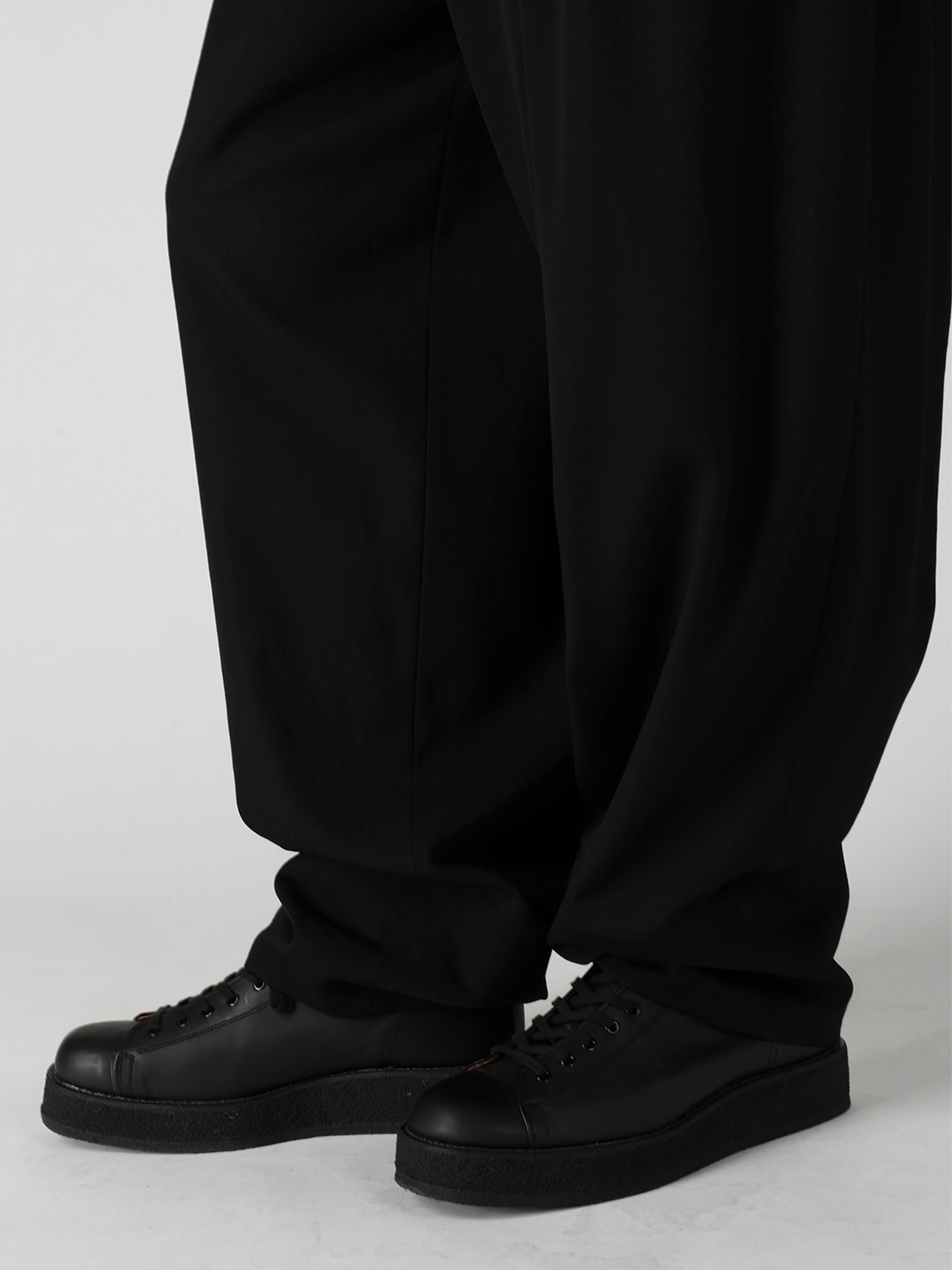 WOOL GABARDINE 16 TUCKS STACKED HEM PANTS