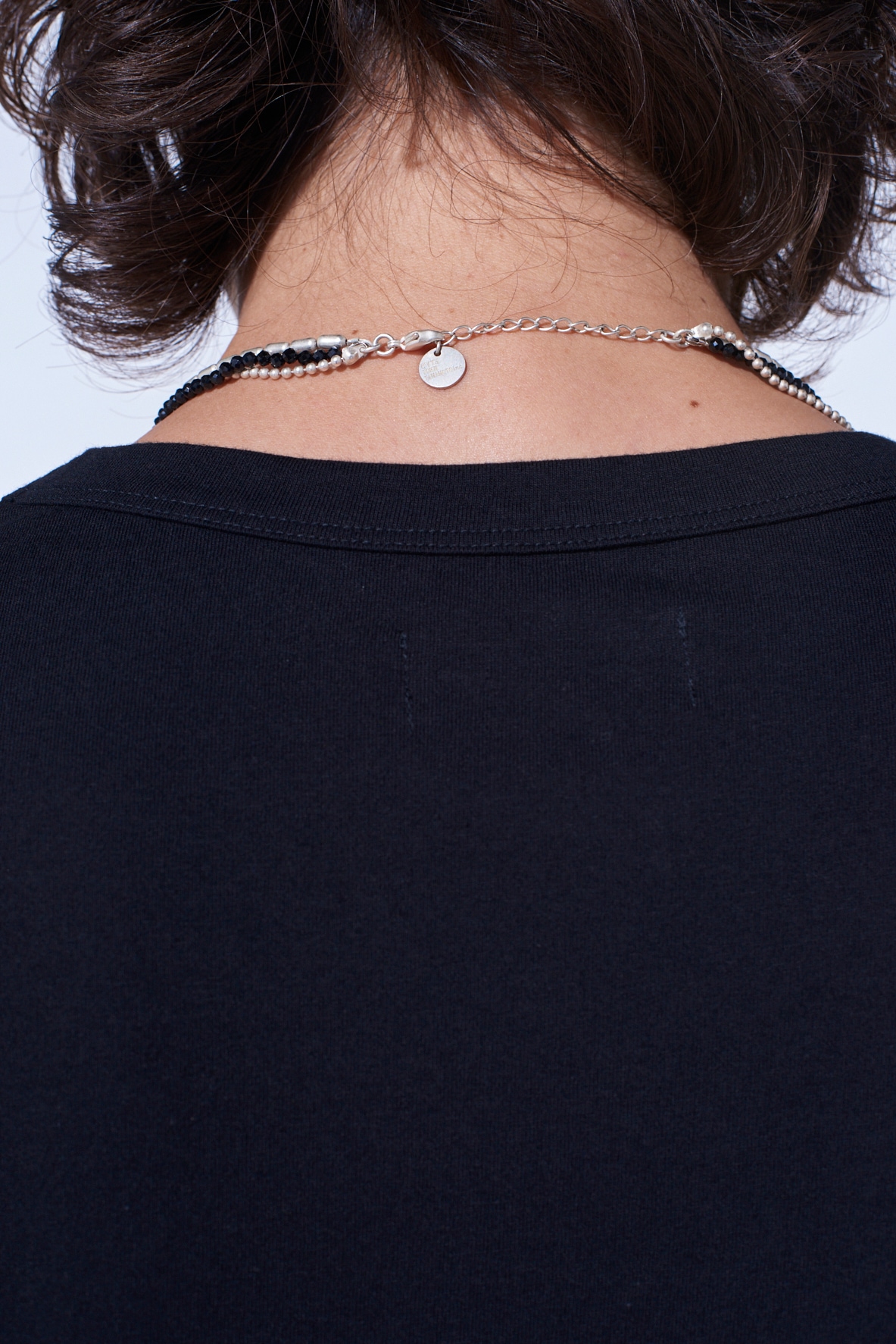 ONYX AND BRASS TASSEL LAYERED NECKLACE