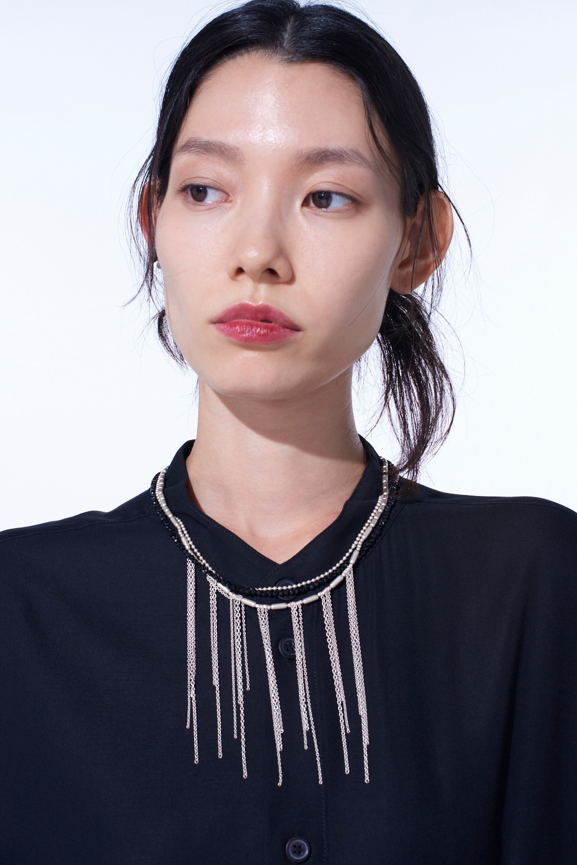 ONYX AND BRASS TASSEL LAYERED NECKLACE