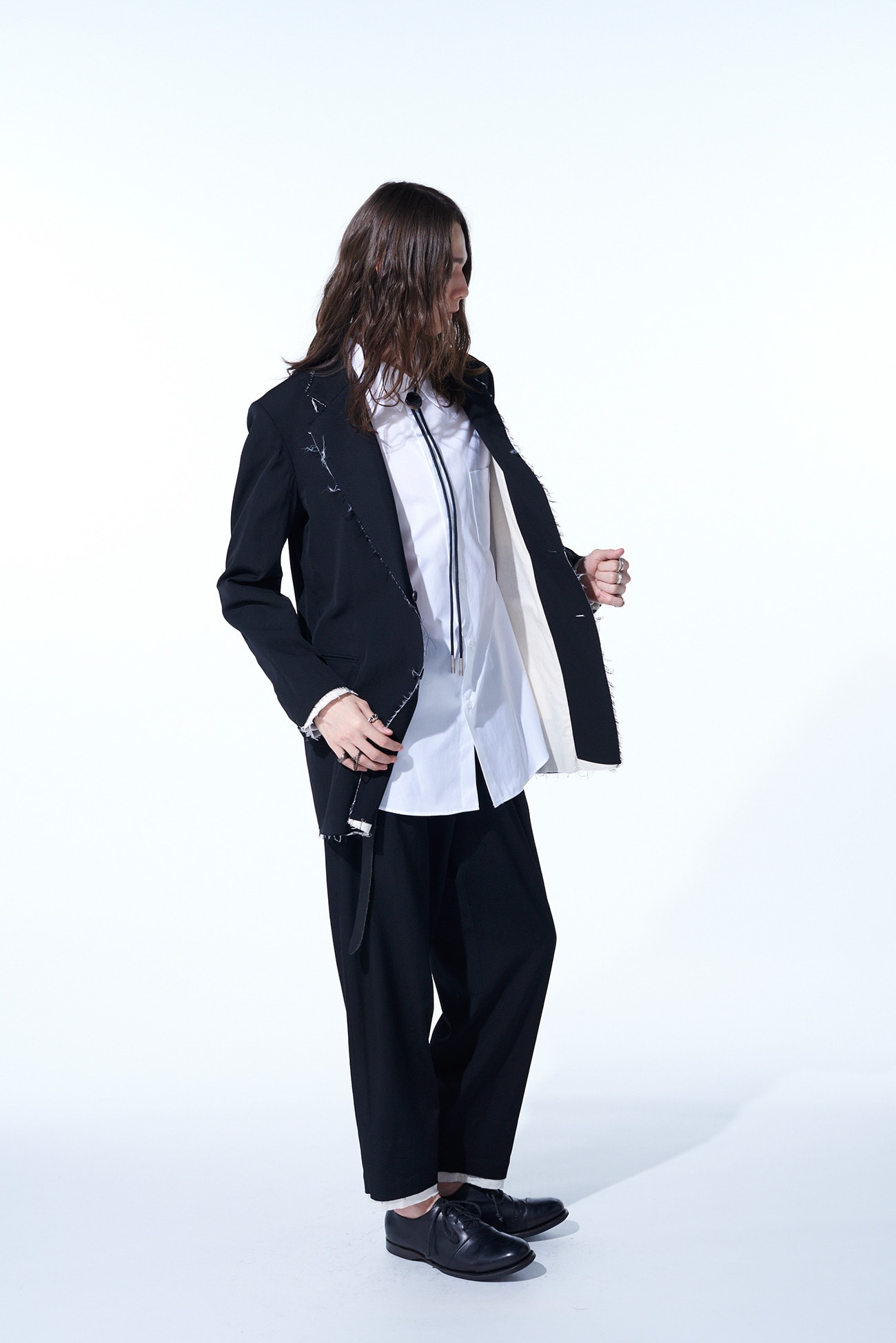 WASHER FINISHED WOOL GABARDINE 2-TUCK PANTS WITH CUT-OUT HEM DESIGN